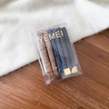 Detail of high-elasticity hair ties in neutral tones stored in an elegant gift box - Brown Blue Apricot