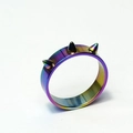 Macro detail of punk rainbow iridescent stainless steel ring with three sharp metal spikes - US 6 / Colorful
