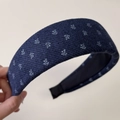 Detailed texture of navy blue floral knit padded headband with soft sponge structure - Wide Blue