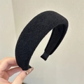 Close-up of black wool texture sponge headband with thick high-crown design padding - Black
