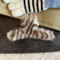 Macro shot of fluffy brown striped faux fur hair claw clip with soft texture details - Green