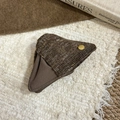 Brown knit triangle mini pouch with gold button and soft winter atmosphere background - Brown Hair Claw