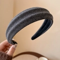 Close-up of the grey glitter fabric texture on this thick non-slip headband accessory - Dark Gray