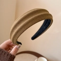 Detail showing the brown knitted texture and non-slip lining of the wide headband - Brown