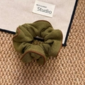 Olive green knit scrunchie with brown trim for a textured oversized hair tie look - Green Scrunchie