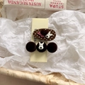 Close-up of two brown hair clips with polka dots, plush balls and cute cartoon charms - Heart Brown Series