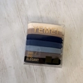 Close-up of 7 gradient colors elastic hair ties in a clear square plastic box - Smooth Blue Coffee Series