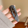 Vintage blue plaid wool hair clip with teardrop design held by hand for scale - Waterdrop Style