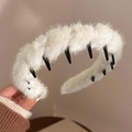 Détail du bandeau en peluche crème avec des dents intérieures noires antidérapantes - Blanc Cassé