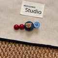 Close-up of hair clip with red beads, denim base, flocked bear and blue button - Red Blue Bear Hair Clip