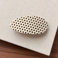 Detailed close-up of oval marble pattern hair clip with gold Barrette La France lettering - Polka Dot
