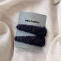 Close-up of black plush lamb wool triangle hair clips on a New Fashion display card - Navy Blue