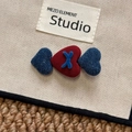 Detailed close-up of triple heart hair clip with blue denim and red fabric textures - Red Blue Heart Hair Clip