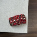 Close-up of knit Christmas hair clip with red green yarn and white pearl details - Christmas Rectangular Red Green