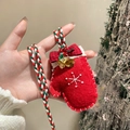 Detail of red felt Christmas glove ornament with snowflake embroidery and bells - Bell Glove