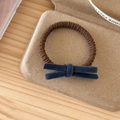 Detail of navy velvet bow hair tie with coffee ribbed elastic band on wooden table - Brown Hair Ring