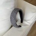 Detail of grey cable knit headband texture and smooth inner lining for winter - Gray