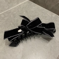 Elegant black velvet bow hair clip with white stitching and gold metal plate detail - Black