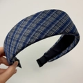 Detail shot of the thick blue and grey plaid tweed texture on the wide French headband - Navy Blue Plaid Headband