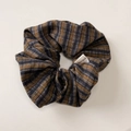 Close-up of blue and brown striped fabric scrunchie with a Hand Made textile label - Yellow Blue Plaid Scrunchie