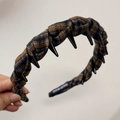 Detail view of handmade brown and black plaid fabric headband with textured black accents - Yellow Blue Plaid Toothed Headband