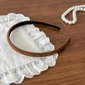 Deep brown matte headband with non-slip lining on a rustic wooden background - Coffee Thin Headband