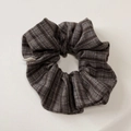Detailed close-up of handmade striped fabric headband with Hand Made woven label - Coffee Plaid Scrunchie