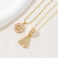 Luxurious gold necklace with cubic zirconia initial A pendant and shimmering stones - Gold - Letter A