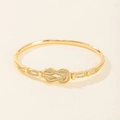 Elegant gold horseshoe buckle bangle with shimmering zircon micro-pave setting for women - Gold