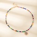 Collana di perle colorate con pendente dorato lettera D e catena regolabile - Lettera D