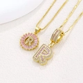 Luxurious gold necklace with letter R pendant featuring pink zircons and rhinestones - Gold R