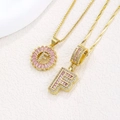 Golden necklace with pink zircon 'F' letter pendants and crystal diamond finish - Gold F