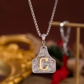 Collier filigrane argenté avec pendentif lettre C dorée sur une chaîne vénitienne - Lettre C