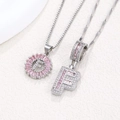 Silver letter F pendant necklace with pink baguette zircon and shimmering crystal accents - Silver F
