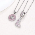 Letter L pendant necklace set with pink baguette zircons in white gold finish - Silver L