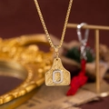 Collana bicolore stile western con ciondolo lettera O a forma di etichetta - Oro O