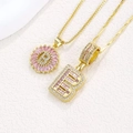 Pink zircon letter B pendant necklaces in gold plating with floral iced out accents - Gold B