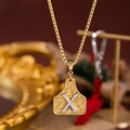 Collana a catena box dorata con pendente a targhetta western e lettera X argentata a contrasto - Oro X