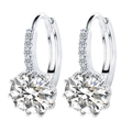 Silver hoop earrings with large round zircon and pave setting on white background - White