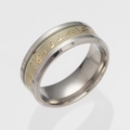 Macro detail of luminous music notes and staff patterns on stainless steel ring - Nocturnal Gold