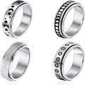 Set of 4 stainless steel spinner rings with moon, star, and frosted sand finish designs - US 5