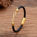 Black woven leather infinity bracelet with gold-plated charm and magnetic clasp - Gold Micro-Pave White Zircon Infinity Style (CZ-20)