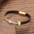 Detail of dark brown leather bracelet with sparkling gold flower charm on wood - Five-Petal Floral Style (Style-5)