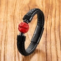 Detail of hand-woven black leather bracelet with red cinnabar bead and black steel clasp - Style 5 (Beast Head)