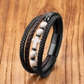 Macro detail of multilayer leather bracelet with cross charm and magnetic clasp - Turquoise Style B
