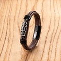 Macro detail of brown leather bracelet with white stitching and ethnic pattern bead - Brown Rope Black Accessories