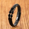Detail of men's leather bracelet with black beads and magnetic buckle on wood - Black Agate