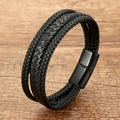 Detailed macro view of triple-strand black braided leather bracelet with magnetic clasp - Black Multilayer Braided Cord With Solid Black Clasp