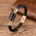 Close-up of black braided leather bracelet with gold metal clasp and striped stone bead - Banded Agate / Gold