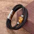 Close-up of handmade leather braided bracelet featuring a tiger eye stone and magnetic clasp - Tiger Eye Olive Bead Style (Silver-4)